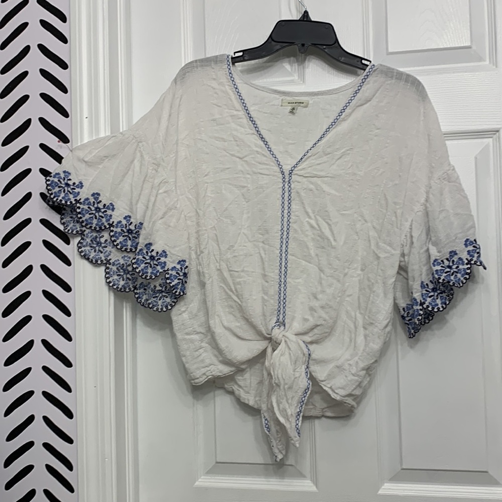 2/$15 White peasant blouse with blue embroidery. Waist tie and bell sleeves